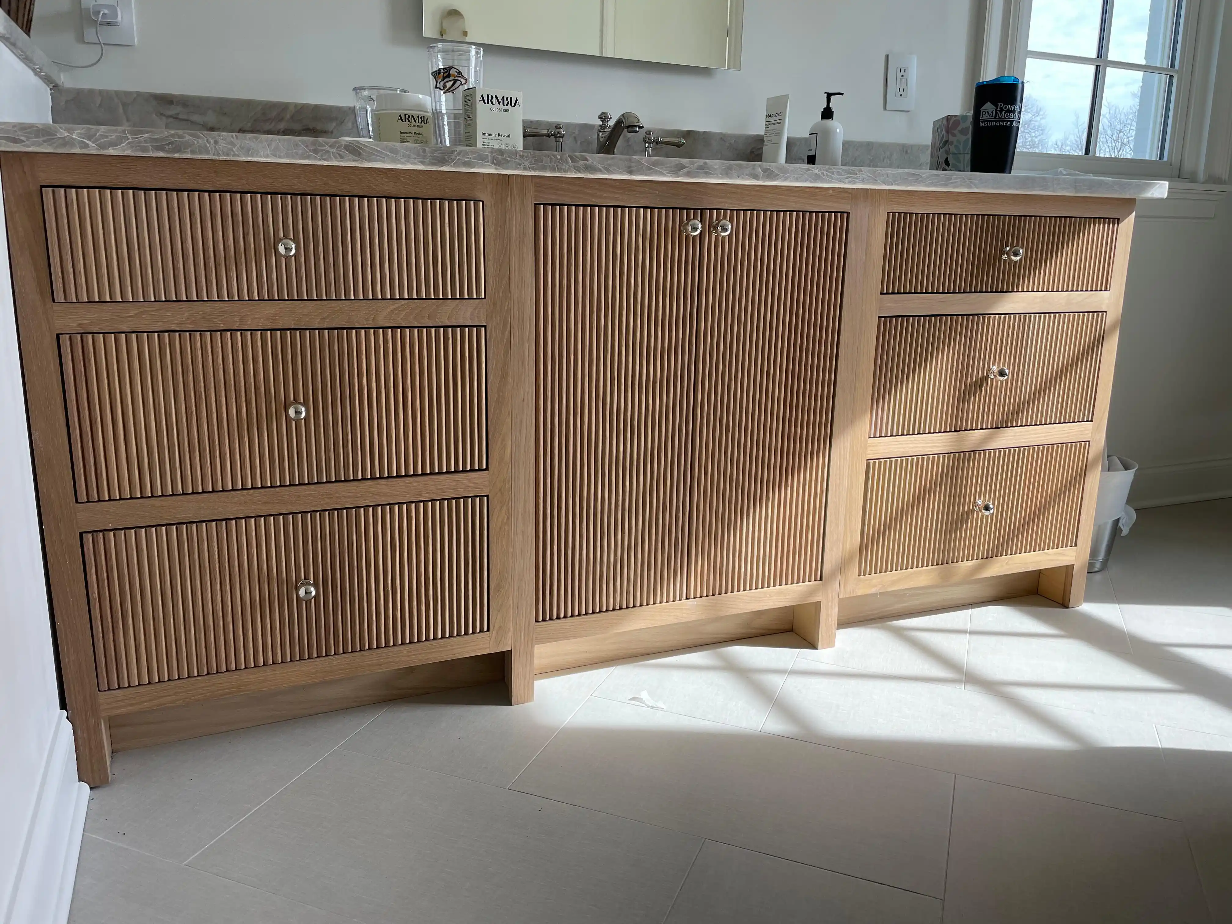 Bathroom vanity and storage cabinets installed